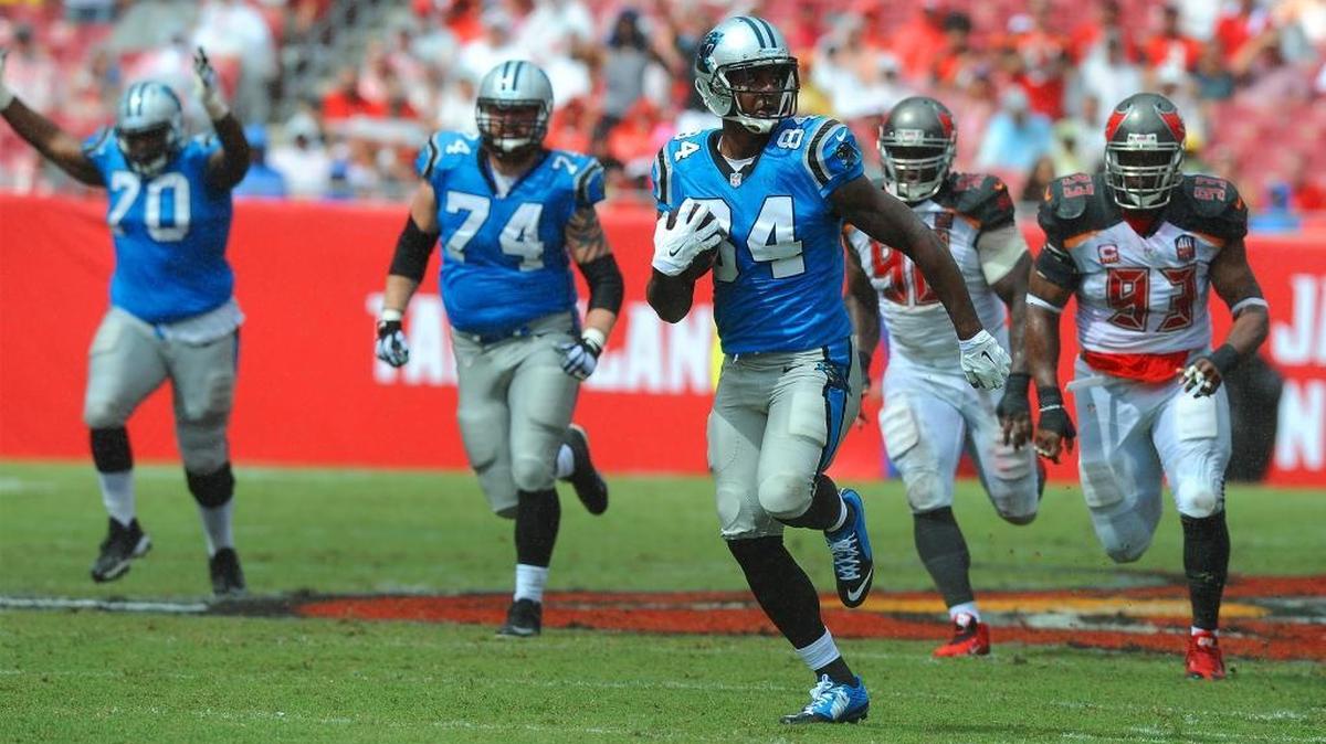 
Carolina Panthers tight end Ed Dickson runs downfield after recovering a fumbled ball by running back Jonathan Stewart who lost control of the ball as he is hit by the Tampa Bay Buccaneers defense during third quarter action on Sunday, October 4, 2015 at Raymond James Stadium in Tampa, Fl. Ed Dickson ran the fumbled ball for a touchdown. The Panthers defeated the Buccaneers 37-23. 
