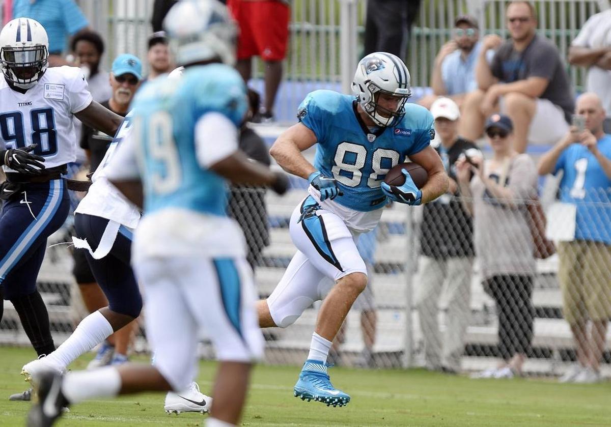 Carolina Panthers tight end Greg Olsen (88) heads upfield after a reception during a joint practice with the Tennessee Titans at St. Thomas Sports Park in Nashville on Wednesday. Olsen said later his goal is to produce, new contract or not.