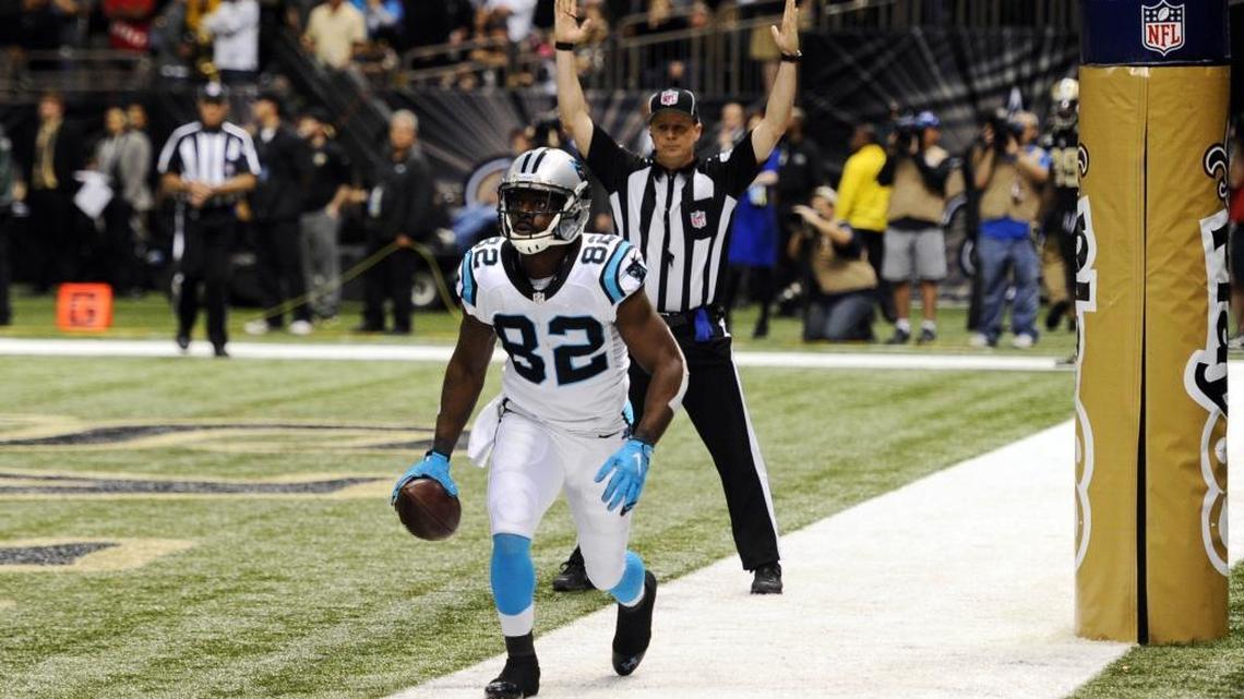 Carolina Panthers receiver Jerricho Cotchery (82) looks up toward the stands after catching the game-winning touchdown against the New Orleans Saints late in the game at Mercedes-Benz Superdome on Sunday. The Panthers won 41-38, and improve to 12-0.