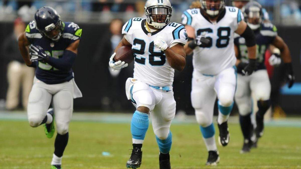 Carolina Panthers running back Jonathan Stewart (28) breaks off a 59-yard run on the Panthers’ first play from scrimmage against the Seattle Seahawks on Sunday.