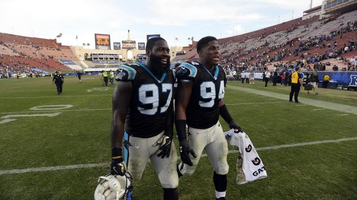 Carolina Panthers defensive end Kony Ealy (94) and defensive end Mario Addison (97) smile as they walk off the field after defeating the Los Angeles Rams at Los Angeles Memorial Coliseum on Sunday. Ealy recorded his first sack of the season, and the Panthers won 13-10.