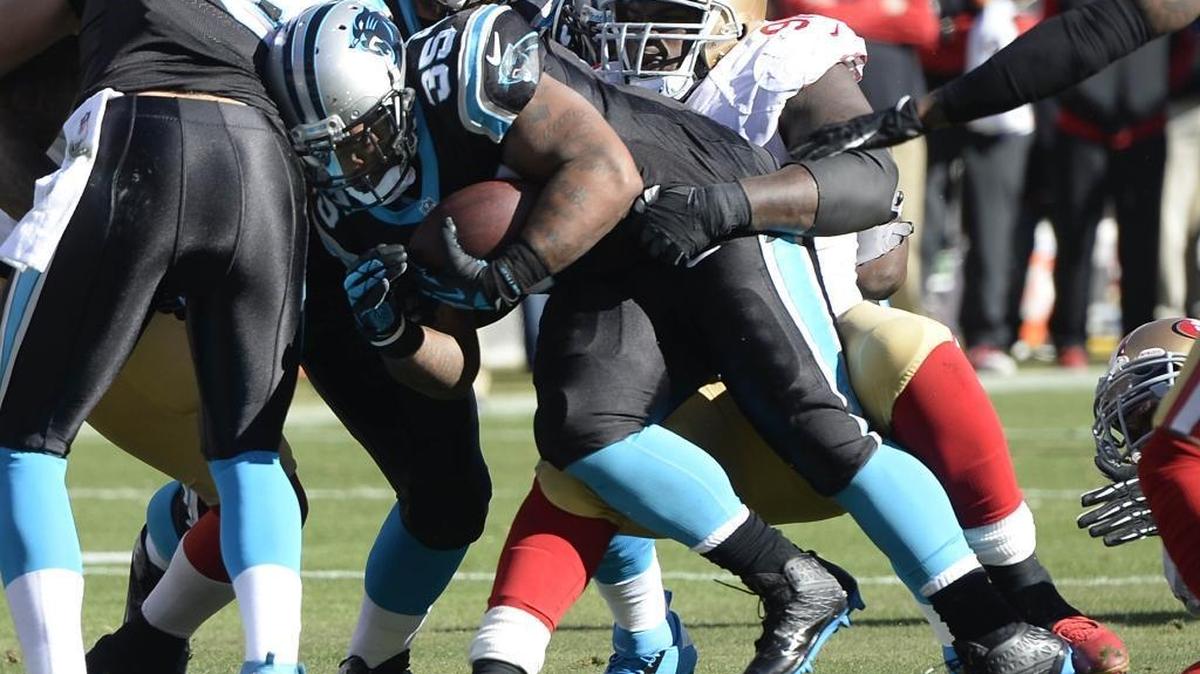 Carolina Panthers fullback Mike Tolbert (35) runs against the San Franciso 49ers in the 2014 NFC playoff game against San Francisco at Bank of America Stadium in Charlotte. The 49ers will visit Charlotte in the Panthers’ 2016 home opener.