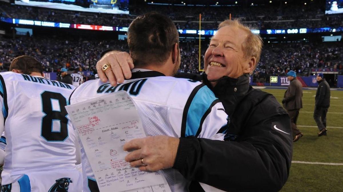 Carolina Panthers kicker Graham Gano, left, is hugged by special teams coordinator Bruce DeHaven, right, following Gano's game winning field goal kick vs the New York Giants in the final seconds of fourth quarter action at MetLife Stadium in East Rutherford, NJ on Sunday, December 20, 2015. The Panthers defeated the Giants 38-35.