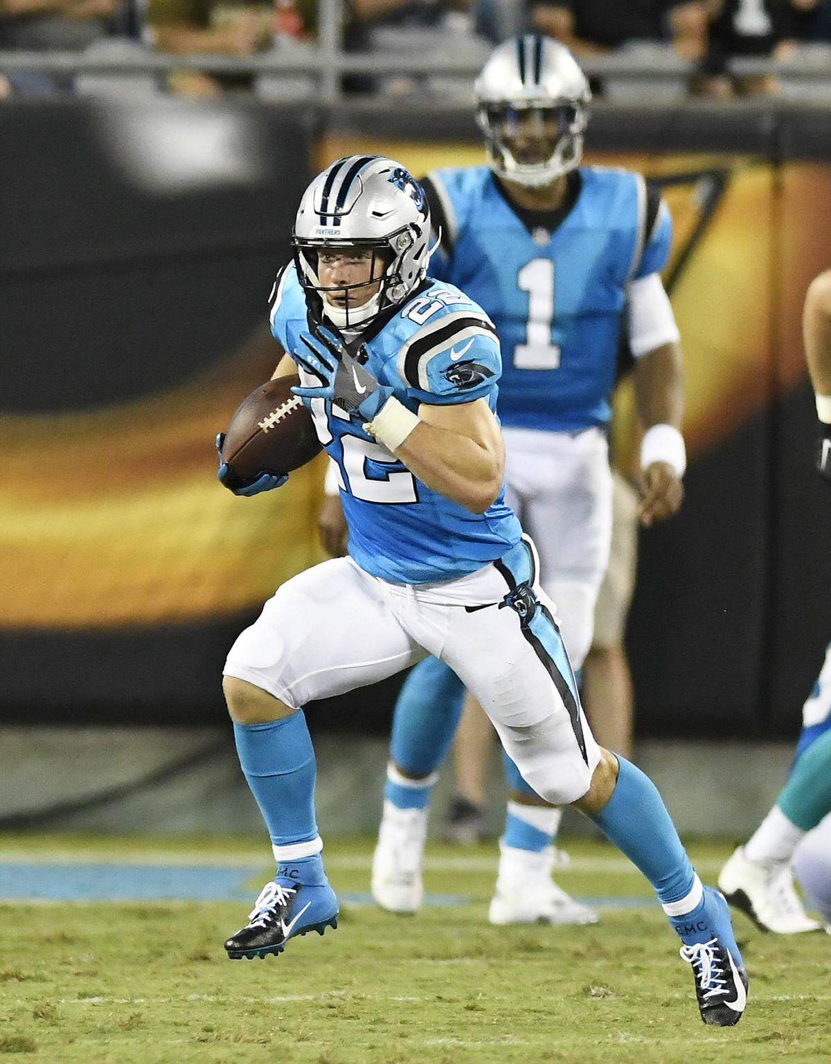Carolina Panthers running back Christian McCaffrey (22) heads upfield against the Miami Dolphins during the first half of their preseason game at Bank of America Stadium on Friday, August 17, 2018.