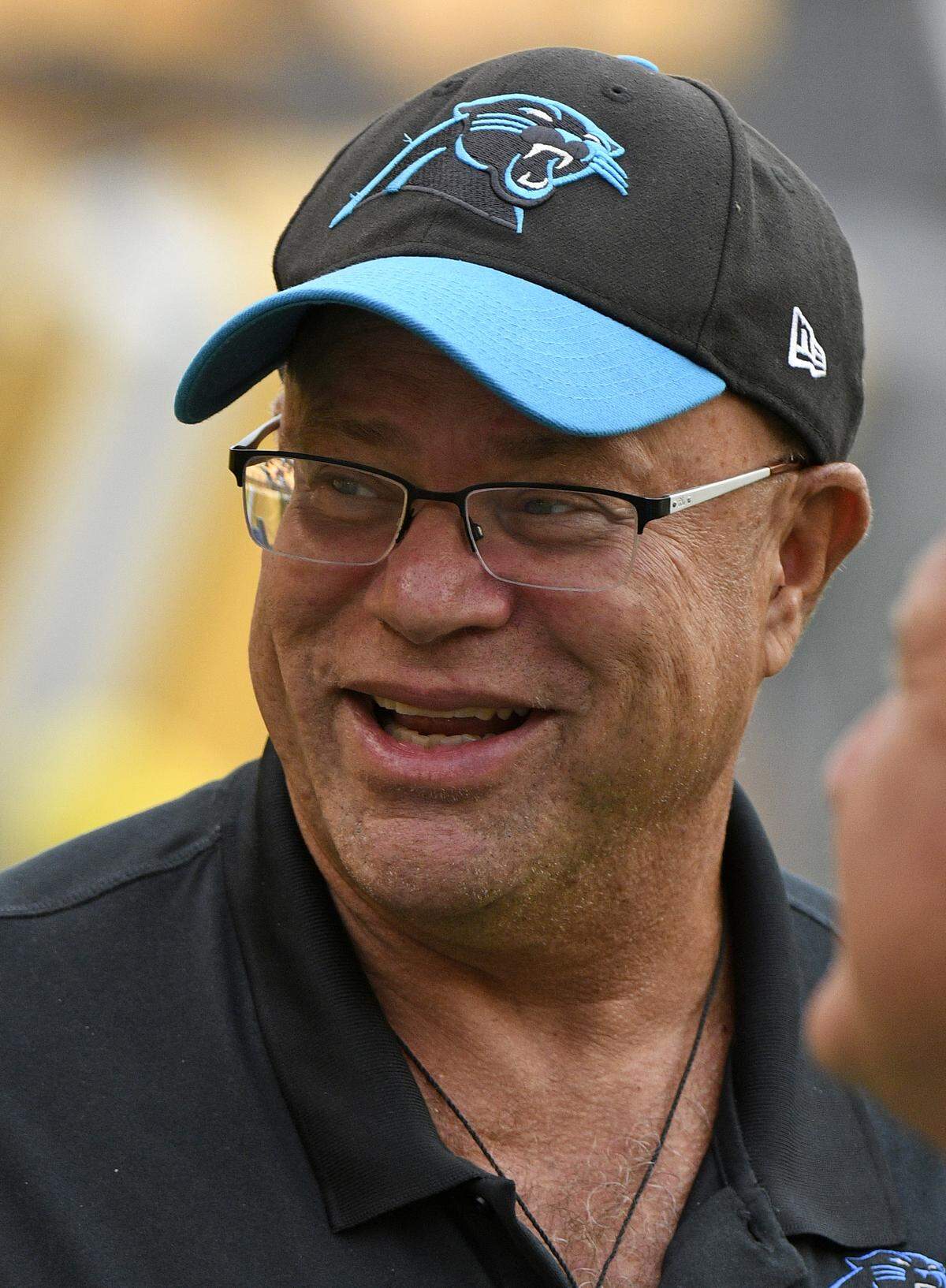 Carolina Panthers owner David Tepper walks in the field during warm ups before an NFL football game between the Pittsburgh Steelers and the Carolina Panthers in Pittsburgh, Thursday, Aug. 30, 2018. (AP Photo/Don Wright)