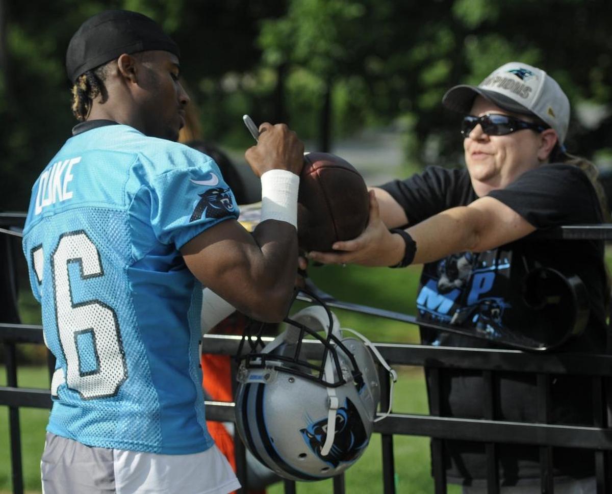 Carolina Panthers rookie wide receiver Austin Duke (16) signs autographs for fans before the last day of mini-camp on Thursday. The Carolina Panthers held their last day of mini-camp on Thursday. First-round draft pick Christian McCaffrey made his debut for the team on Thursday. Photos were made at the Panthers Practice Field on June 15, 2017.