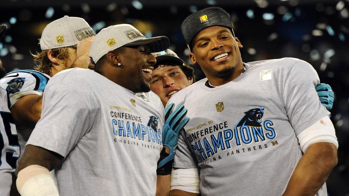 Carolina Panthers outside linebacker Thomas Davis (58), middle linebacker Luke Kuechly (59), and quarterback Cam Newton (1) smile while celebrating during the awards ceremony after the team defeated the Arizona Cardinals in the NFC Championship game at Bank of America Stadium on Sunday, January 24, 2016.