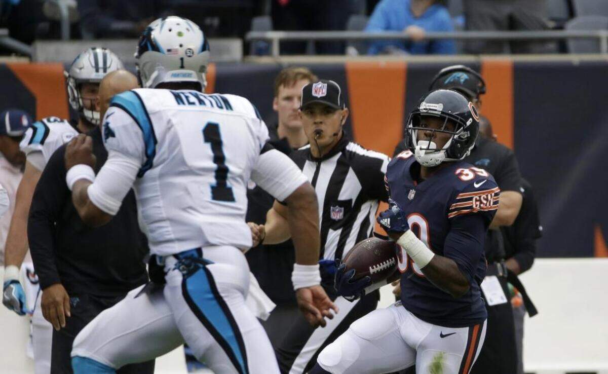 Chicago Bears free safety Eddie Jackson (39) returns an interception thrown by Carolina Panthers quarterback Cam Newton (1) for a 76-yard touchdown during the first half of Sunday’s game at Soldier Field. The Panthers allowed a pair of defensive touchdowns in the first half – both by Jackson, a rookie.