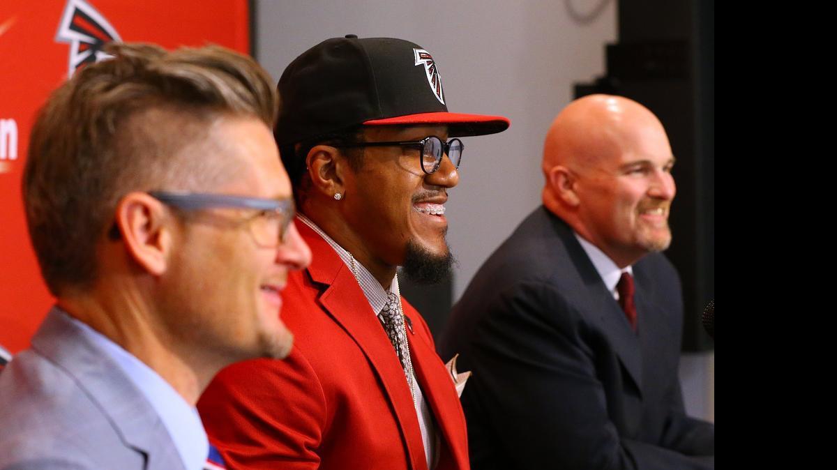 
Atlanta Falcons General Manager Thomas Dimitroff, left, and head coach Dan Quinn (right) flank first-round draft pick Vic Beasley at the Falcons training facility on May 1. The Falcons’ offseason moves have been widely lauded around the league. 
