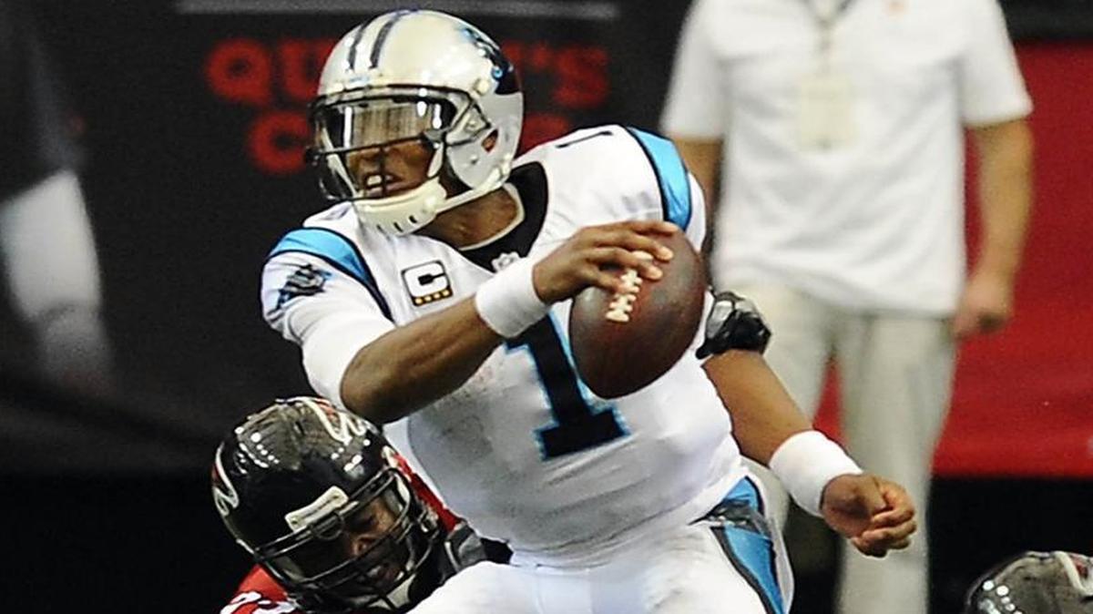 Carolina Panthers quarterback Cam Newton (1) is sacked by Atlanta Falcons defensive end Dwight Freeney (93) in the first half at the Georgia Dome on Sunday.