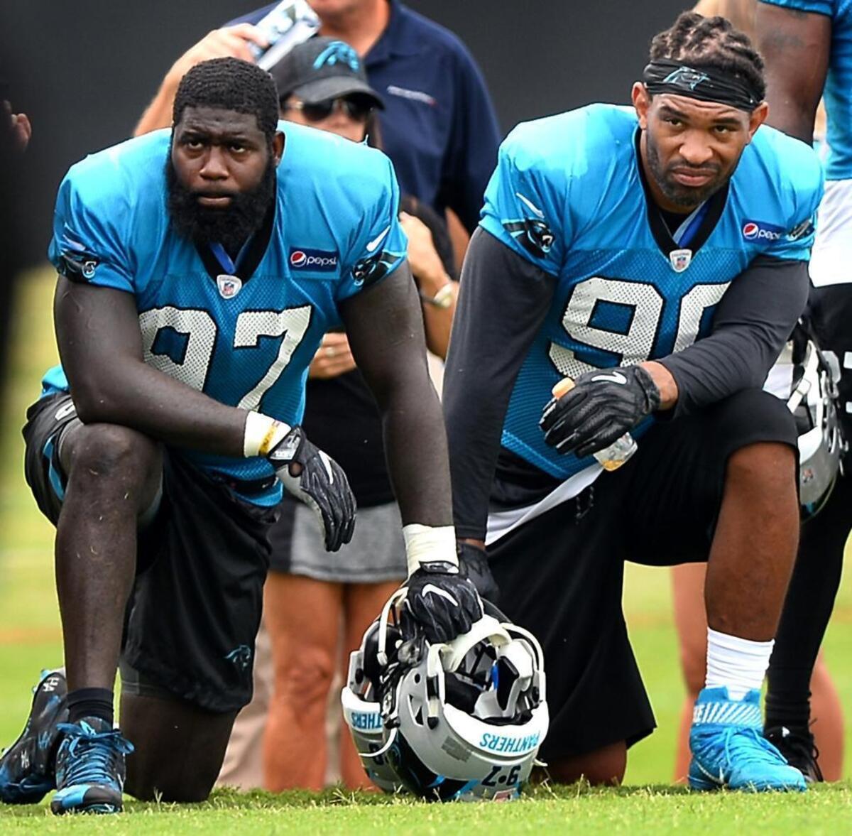 Panthers defensive ends Mario Addison (left) and Julius Peppers will be two of the four players rotating regularly at the position for Carolina this season.