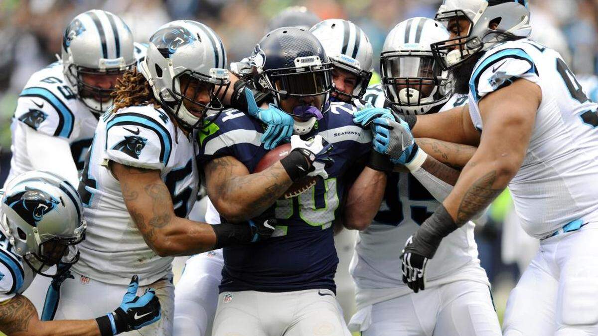 Seattle Seahawks running back Marshawn Lynch (24) was held to 20 rushing yards by a swarming Panthers defense.