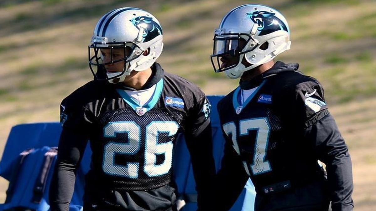 Carolina Panthers cornerbacks Cortland Finnegan, left, and Robert McClain run through drills during practice on Wednesday. Sunday, they could get a lot of Seattle quarterback Russell Wilson’s attention.
