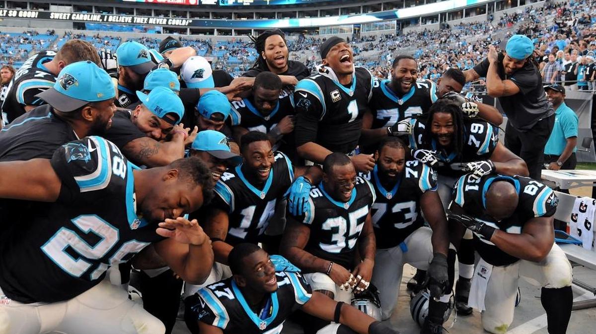 Members of the Carolina Panthers laugh after coming together for a group Dab photo in the closing moments of action vs the Atlanta Falcons at Bank of America Stadium in Charlotte, NC on Sunday, December 13, 2015. The Panthers defeated the Falcons 38-0.