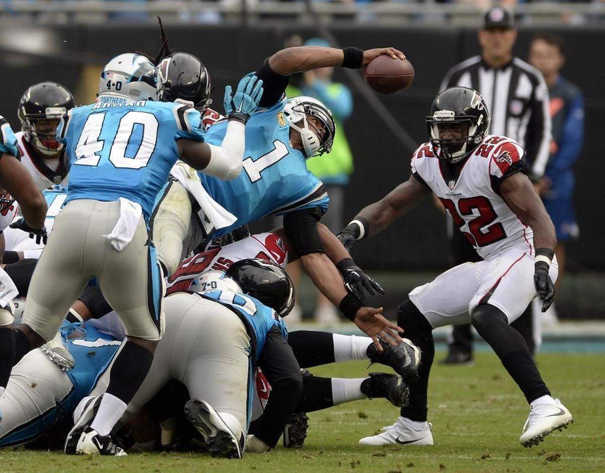 Panthers coach Ron Rivera said he’s OK with quarterback Cam Newton (1) running as long as offensive coordinator Mike Shula does so judiciously and Newton is smart about sliding and going out of bounds to avoid big collisions.