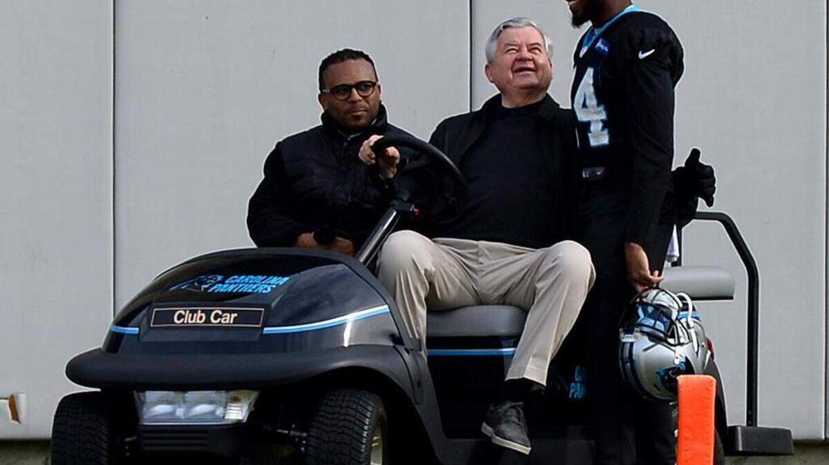 Carolina Panthers cornerback Josh Norman, right, talks with team owner Jerry Richardson, center, during practice on Thursday. Looking on at left is Panthers director of communications Steven Drummond.