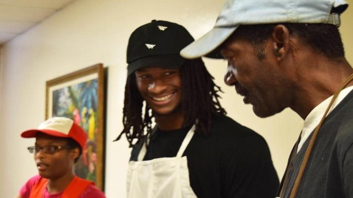 Los Angeles Rams running back Todd Gurley helps serve meals at Food Bank of Central and Eastern North Carolina in support of flood relief efforts in Tarboro, N.C. Gurley played football for Tarboro High.