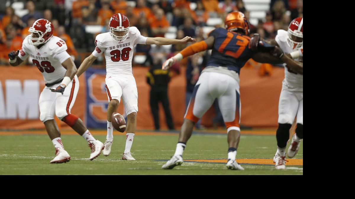 
N.C. State's Wil Baumann (36) punts during the second half of the Wolfpack’s 24-17 victory over Syracuse at the Carrier Dome in Syracuse, N.Y., Saturday, Nov. 1, 2104.
