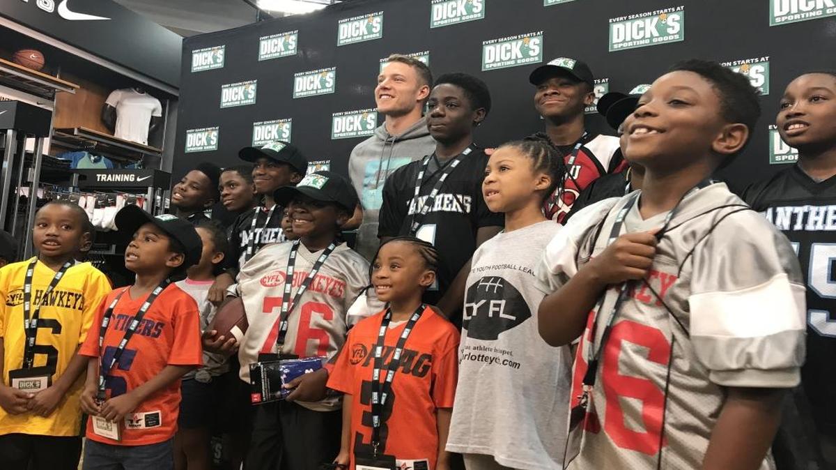Carolina Panthers running back Christian McCaffrey gets a group photo with a group of Charlotte Youth Football players on Friday morning after a surprise $150 shopping spree to kick off DICK’S Sporting Goods’ first annual “Celebrate Youth Sports Weekend” from July 14-16.