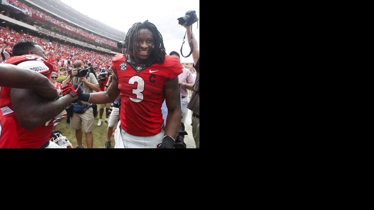 
Georgia running back Todd Gurley (3) will visit with the Carolina Panthers this week, according to reports. He suffered an ACL injury late in the 2014 season and is still recovering. 
