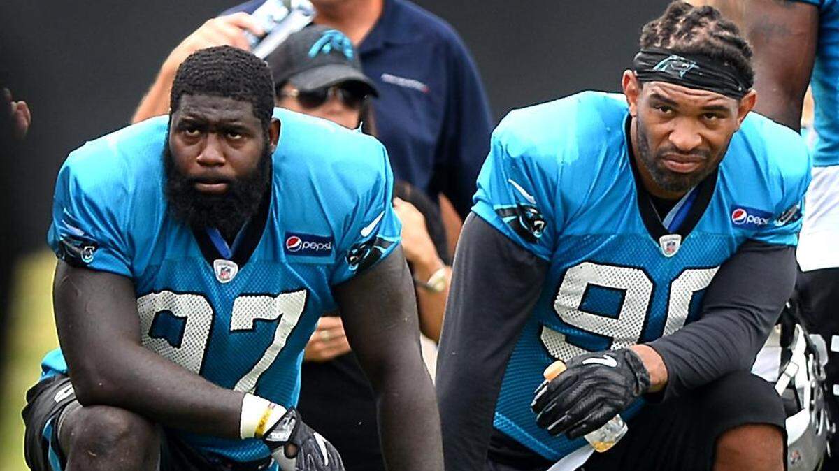 Defensive ends Mario Addison, left, and Julius Peppers each had 11 sacks to lead the Carolina Panthers last season.