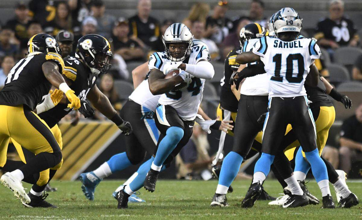 Carolina Panthers running back Cameron Artis-Payne (34) finds running room against the Pittsburgh Steelers in the first half during the last game of preseason at Heinz Field on Thursday, August 30, 2018.