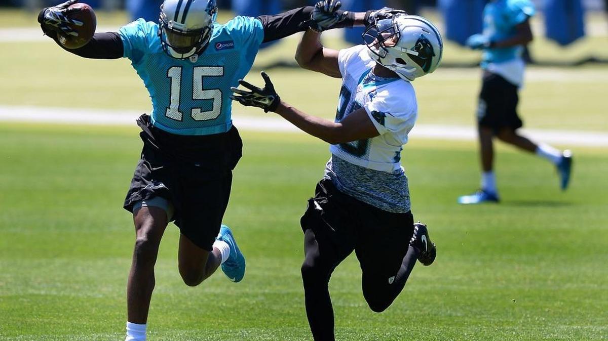 Carolina Panthers rookie receiver Keyarris Garrett, left, stiff arms rookie cornerback Daryl Worley during the team's rookie minicamp in May. Garrett, who was undrafted after leading the nation in receiving while at Tulsa, enjoyed probably his best practice with the Panthers on Wednesday.