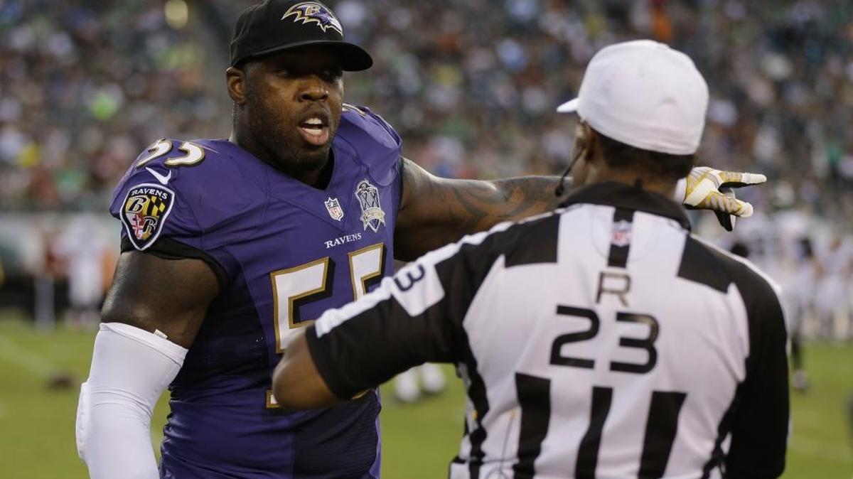 
Baltimore Ravens end Terrell Suggs, left, was wrongly penalized for a hit on Eagles quarterback Sam Bradford on Saturday, sparking a conversation with referee Jerome Boger.
