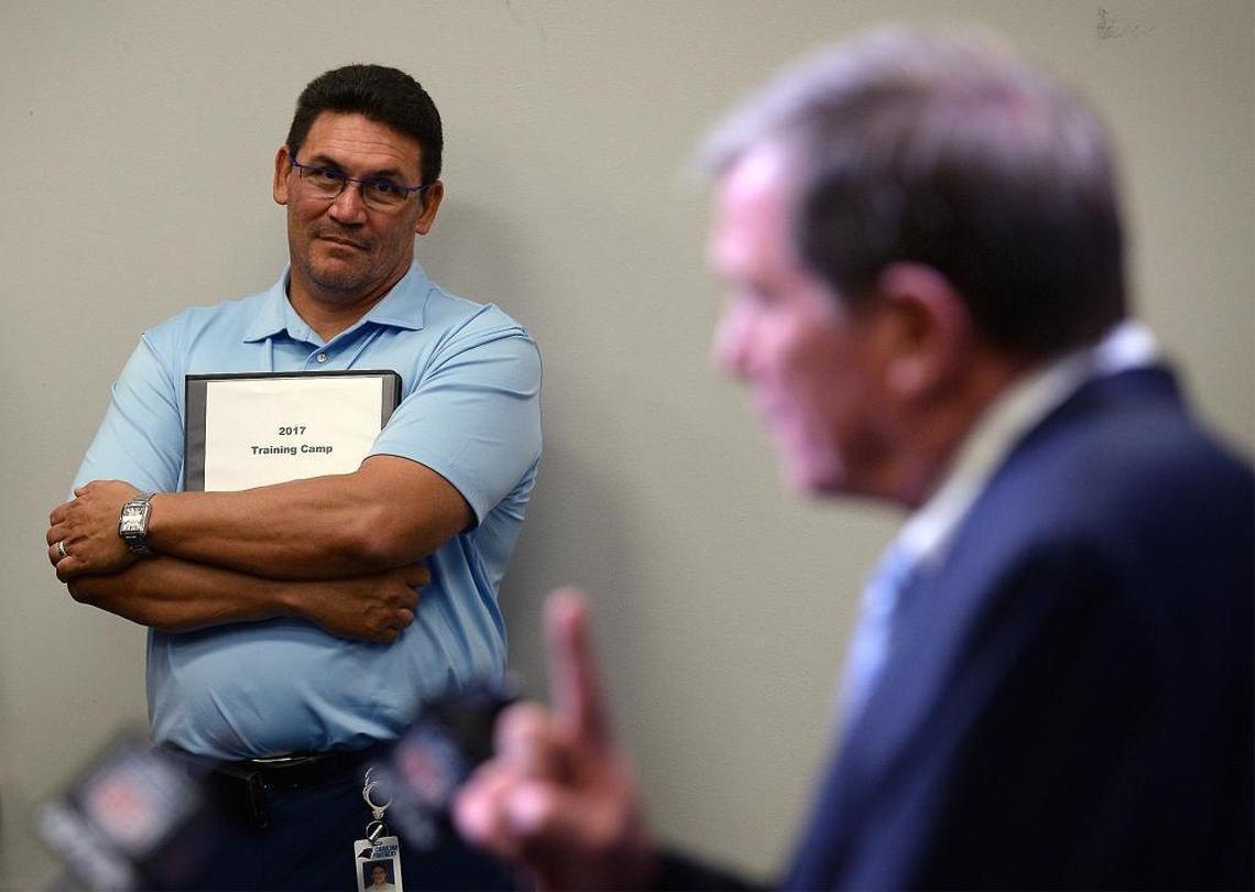 Carolina Panthers head coach Ron Rivera listens as Marty Hurney discusses what he has learned since his first stint as general manager of the Carolina Panthers. Rivera says the mutual trust between the two makes Hurney, introduced as the interim GM on Wednesday, the right guy at the right time.
