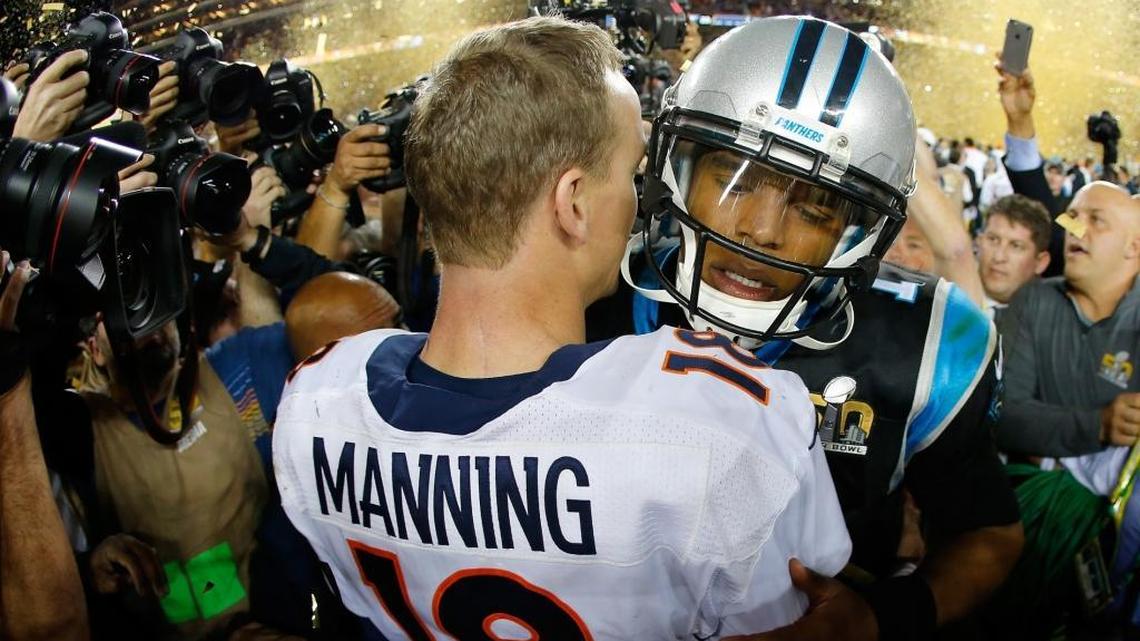 Carolina Panthers quarterback Cam Newton talks with Denver Broncos quarterback Peyton Manning (18) after the Broncos defeated the Panthers 24-10 to win Super Bowl 50 on Sunday.