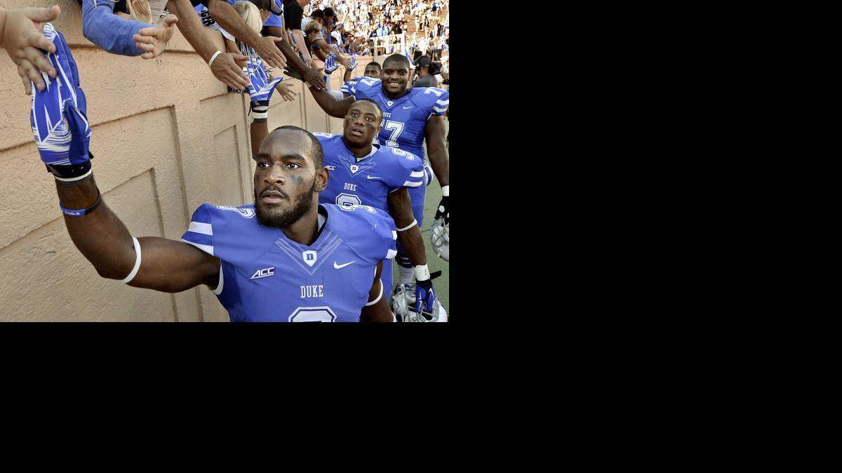 
Duke wide receiver Jamison Crowder (front)), pictured here after Duke beat Virginia 20-13 in Durham in September, is sprinting toward a spot in the NFL.
