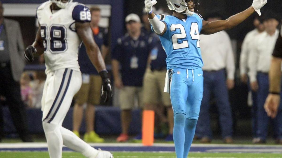 Carolina Panthers' Josh Norman (24) reacts after defending Dallas Cowboys' Dez Bryant (88) during the second half of their game at AT&T Stadium on Thursday, November 26, 2015. The Panthers won 33-14 and improved to 11-0.