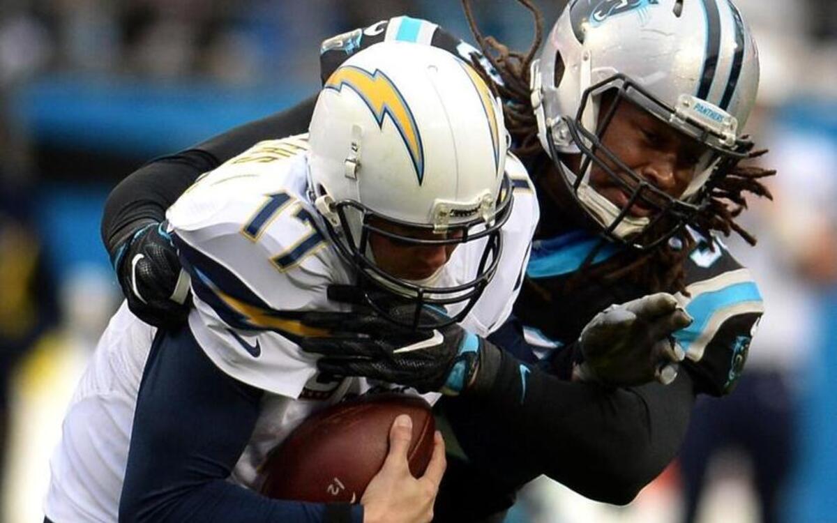 Carolina Panthers defensive end Ryan Delaire sacks San Diego Chargers quarterback Philip Rivers during the second quarter of Sunday’s 28-16 Panthers victory. Carolina leads the NFL in sacks.