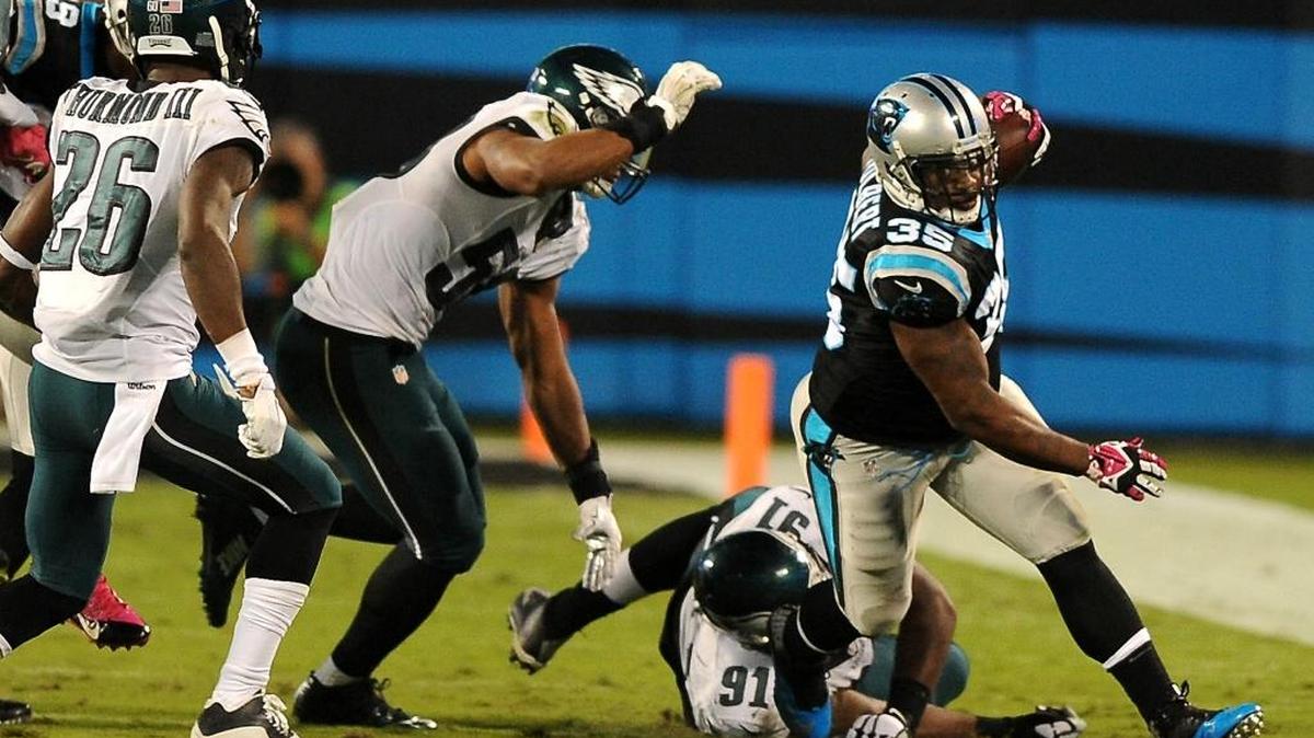 Carolina Panthers fullback Mike Tolbert breaks to the outside for yardage as the Philadelphia Eagles defense gives chase during third quarter action at Bank of America Stadium in Charlotte, on Sunday. The Panthers defeated the Eagles 27-16.