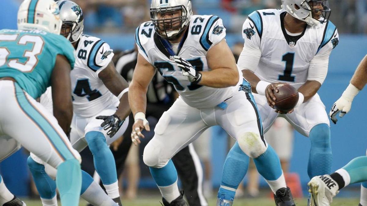 
Carolina Panthers center Ryan Kalil (67) prepares to block after he hiked the football to quarterback Cam Newton (1) against the Miami Dolphins during the first half of an NFL preseason football game Saturday. 
