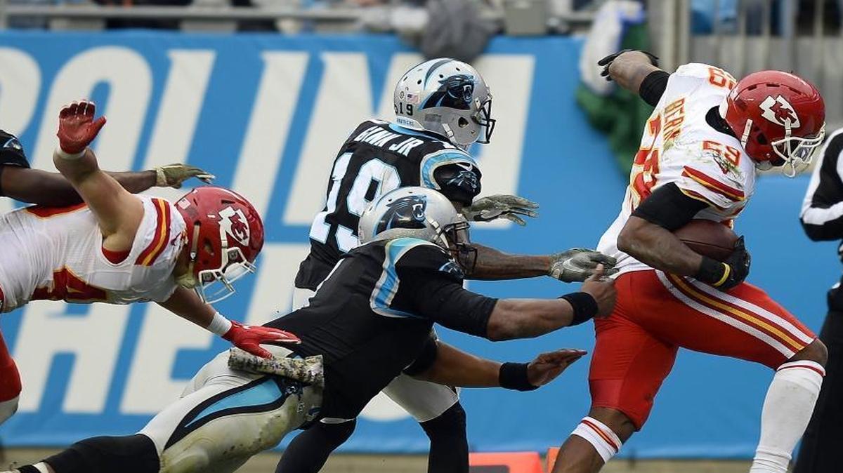 Kansas City Chiefs defensive back Eric Berry (29) scores a touchdown past Carolina Panthers quarterback Cam Newton (1) and wide receiver Ted Ginn Jr (19) after making a interception in Sunday’s game.