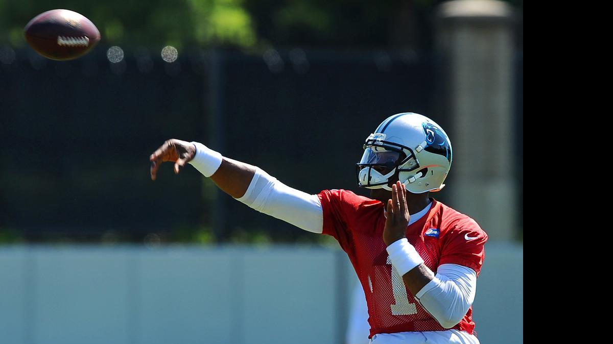 
Carolina Panthers quarterback Cam Newton throws during the team's minicamp in Charlotte, N.C., on Wednesday, June 17, 2015. (Jeff Siner/Charlotte Observer/TNS)
