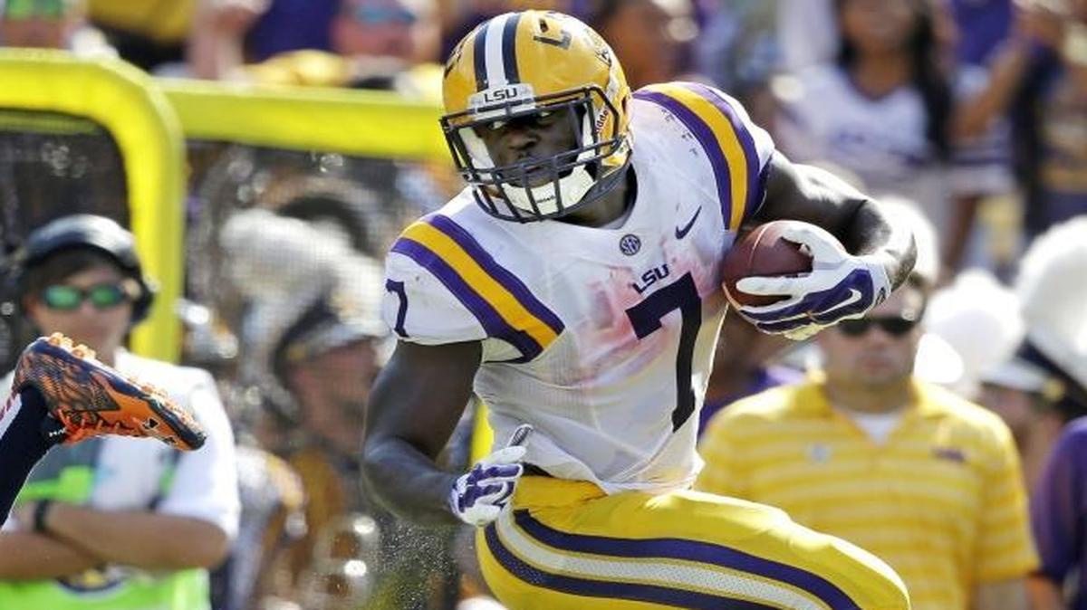 LSU running back Leonard Fournette (7) enjoys running over defensive backs, and actually practiced doing so while with the Tigers. Joseph Person says he should be Panthers’ pick at No. 8.