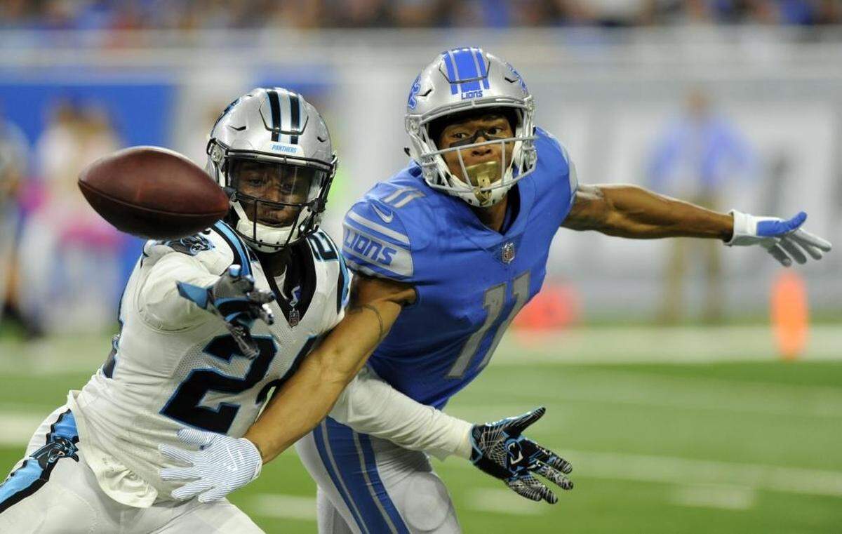 Carolina Panthers cornerback James Bradberry (24) deflects a pass intended for Detroit Lions wide receiver Marvin Jones (11) during the second half of an NFL football game, Sunday, Oct. 8, 2017, in Detroit. (AP Photo/Jose Juarez)