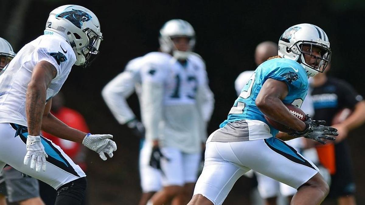 Carolina Panthers cornerback Cole Luke, right, glances over his shoulder after intercepting a pass during practice on Saturday, July 29, 2017 at Wofford College in Spartanburg, SC.