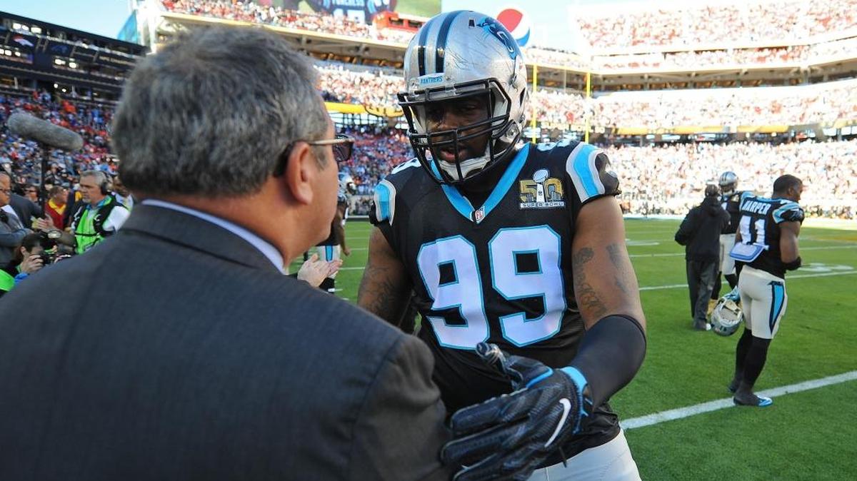 Carolina Panthers general manager Dave Gettleman, left, and defensive tackle Kawann Short greet one another before Super Bowl 50 vs. the Denver Broncos at Levi’s Stadium in Santa Clara, Calif. Short is entering the fourth year of his four-year rookie contract and seeking a long-term deal from Gettleman and the team.
