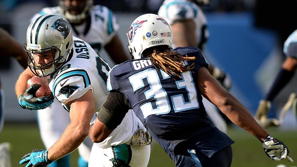 Carolina Panthers tight end Greg Olsen looks to pick up yardage following a pass reception as Tennessee Titans safety Michael Griffin applies pressure during fourth quarter action at Nissan Stadium in Nashville, TN. on Sunday, November 15, 2015. The Panthers defeated the Titans 27-10.