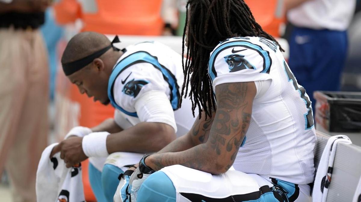Carolina Panthers receiver Kelvin Benjamin, right, and quarterback Cam Newton take a breather on the bench late in Sunday’s game against Minnesota. In the game, Benjamin was slapped with an illegal-block penalty that cost the Panthers a touchdown in their 22-10 loss.