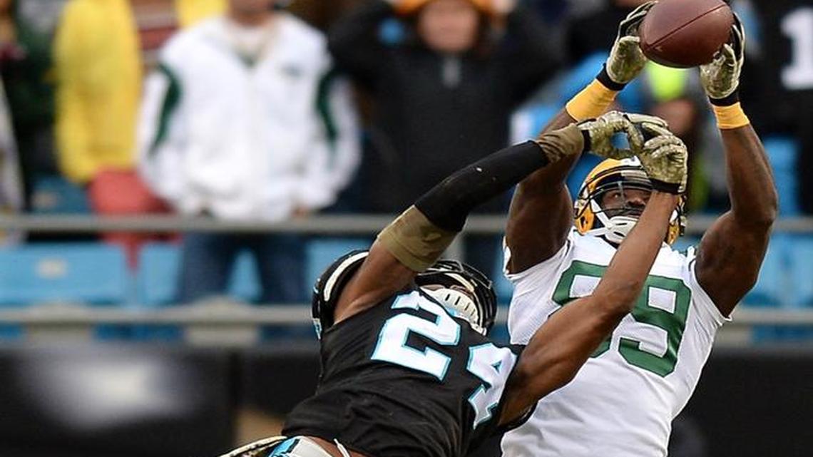 Green Bay Packers wide receiver James Jones leverages a pass away from Carolina Panthers cornerback Josh Norman on fourth and 14 in the fourth quarter, keeping a Packers drive alive.