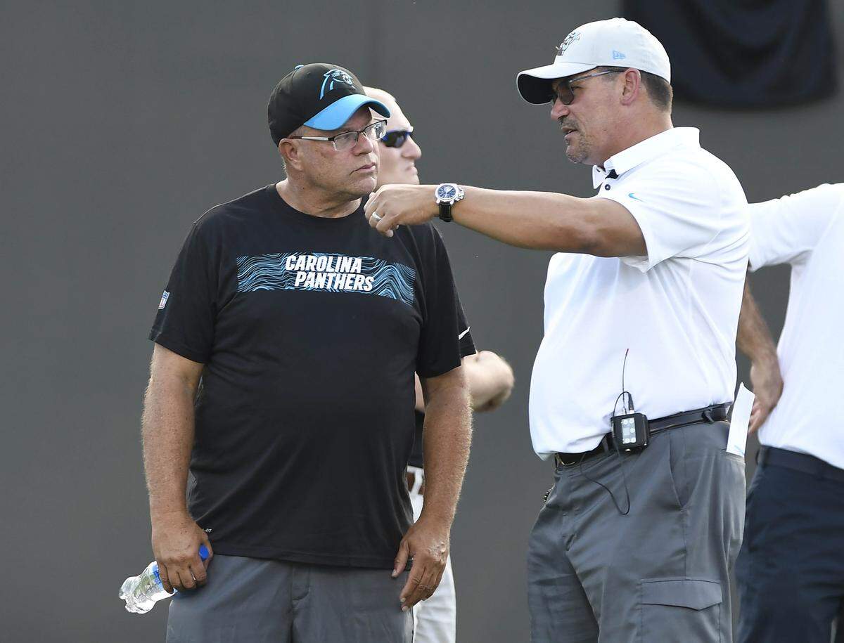 Carolina Panthers owner David Tepper talks with head coach Ron Rivera during the first practice at Training Camp 2018 in Gibbs Stadium at Wofford College in Spartanburg, SC.