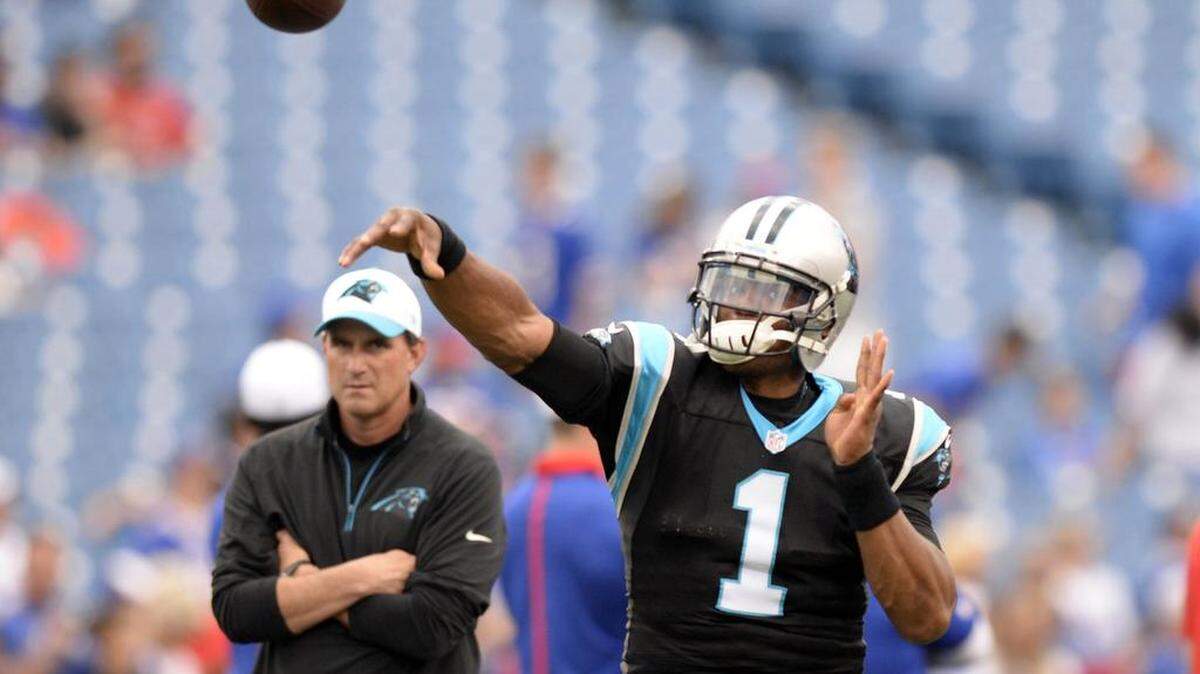 
Carolina Panthers' Cam Newton (1) throws downfield during warmups prior to playing the Buffalo Bills in their preseason game at Ralph Wilson Stadium on Friday, August 14, 2015.
