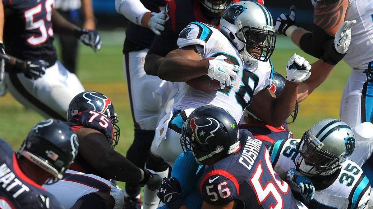 Panthers running back Jonathan Stewart, center with ball, has rushed for 298 yards in five games this season including 62 yards against the Texans.