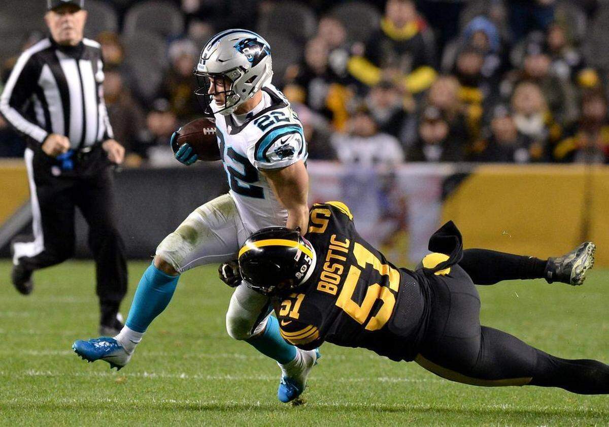 Carolina Panthers running back Christian McCaffrey, left, is hit by Pittsburgh Steelers linebacker Jon Bostic, right, during second quarter action at Heinz Field in Pittsburgh, PA on Thursday, November 8, 2018.
