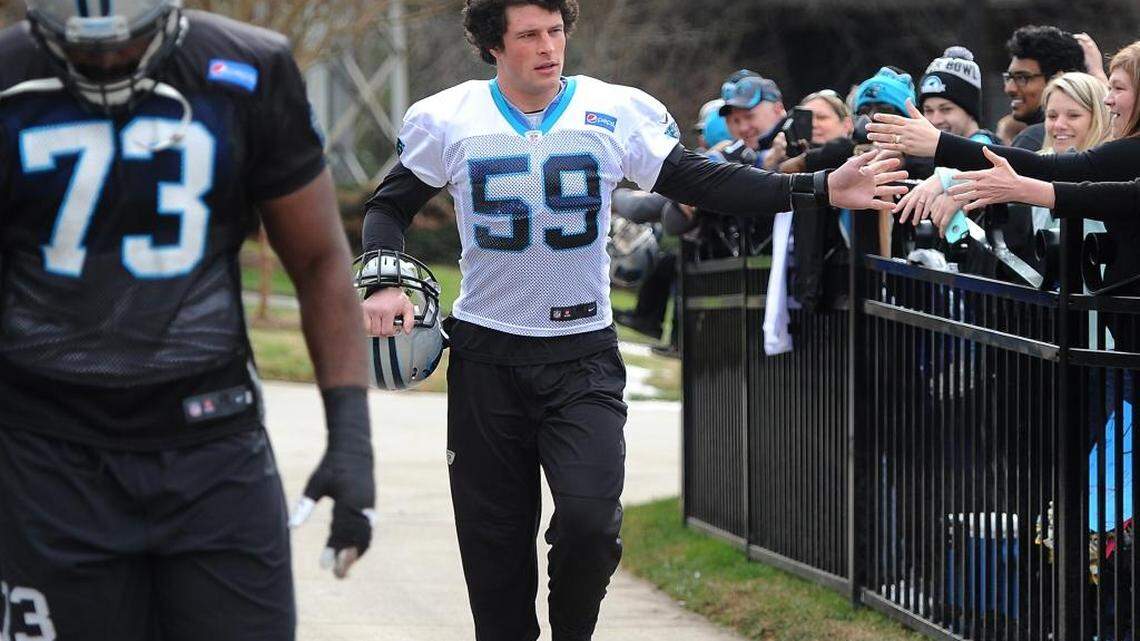 Carolina Panthers linebacker Luke Kuechly (59) has been growing out his hair for months and was happy when someone noticed on Thursday.
