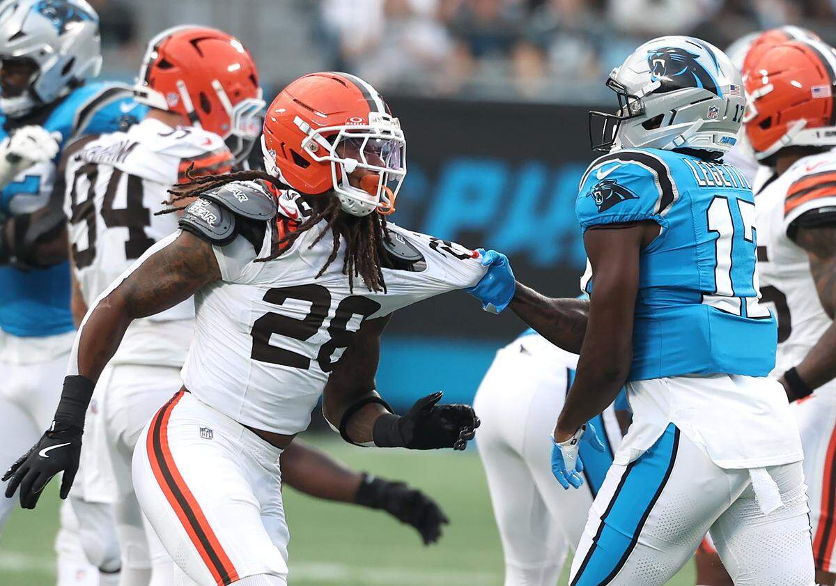 Carolina Panthers wide receiver Xavier Legette, right, grabs ahold of Cleveland Browns safety Rayshawn Jenkins’ jersey following a play during Friday’s game at Bank of America Stadium. The players were both ruled ineligible following the skirmish.